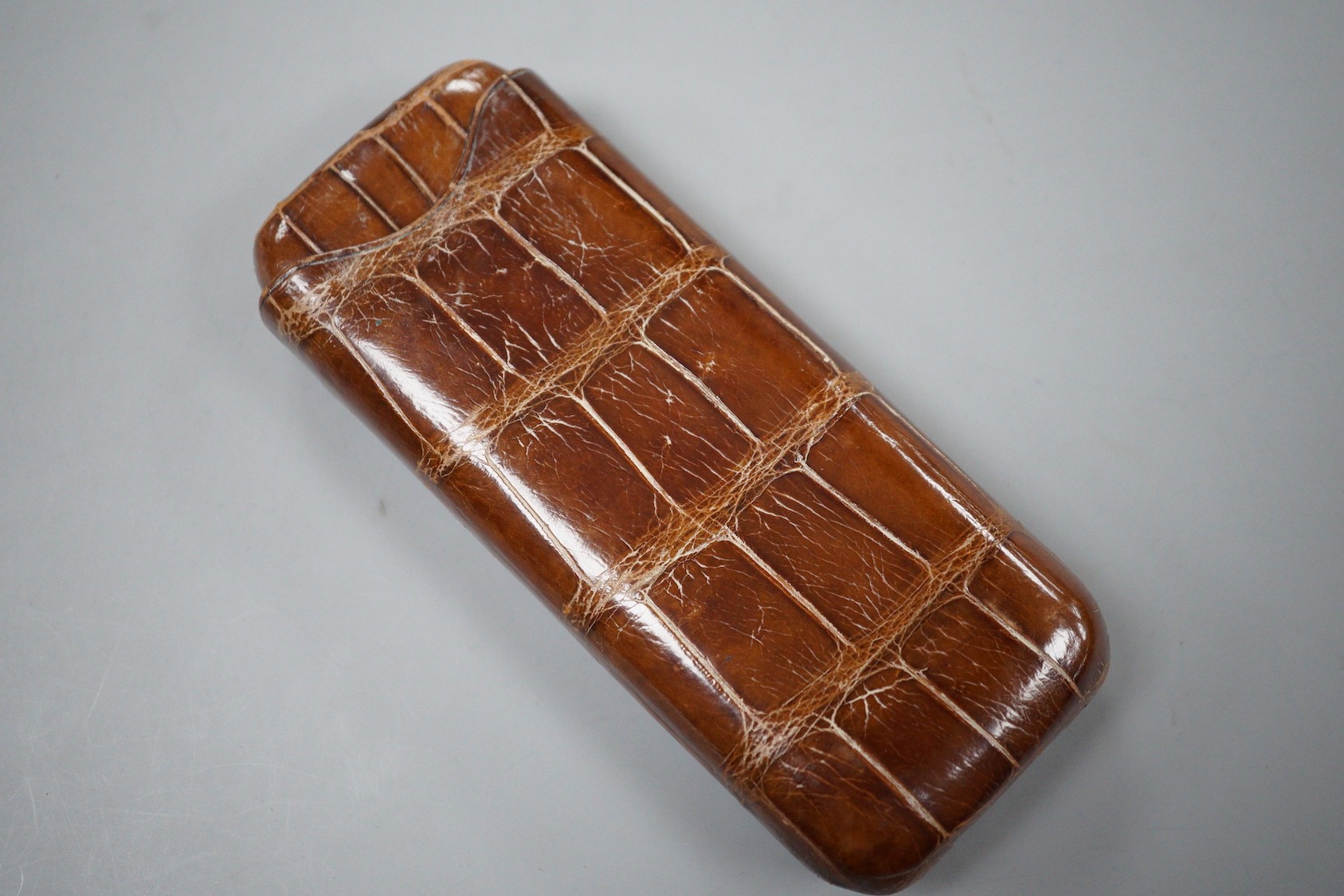 A crocodile cigar case by Drew & Sons Piccadilly Circus, pre-1940, 14.5cm long